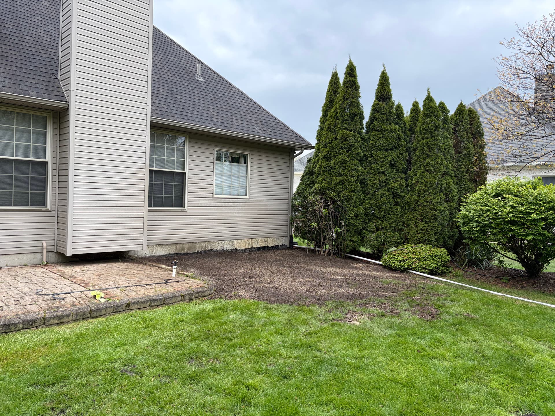 Rock Bed and Bush Removal with Fresh Topsoil and Seed in New Boston